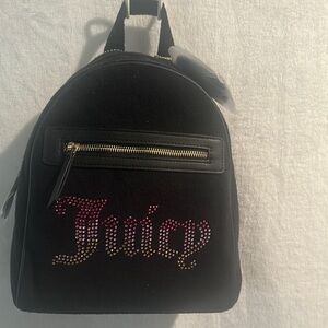 NWT Juicy Couture Liquorice Big Spender Backpack with attached heart Charm.